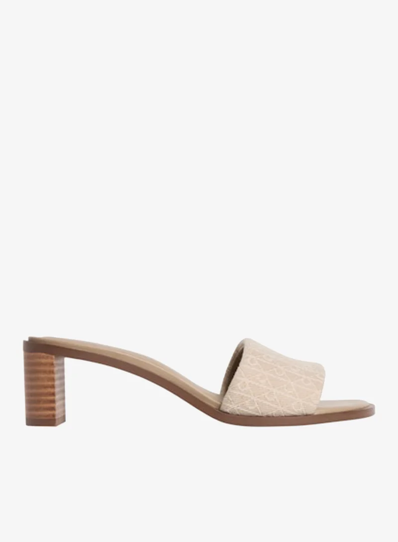 كالفن كلاين صنادل مارغي بكعب مزينة بشعار جاكار